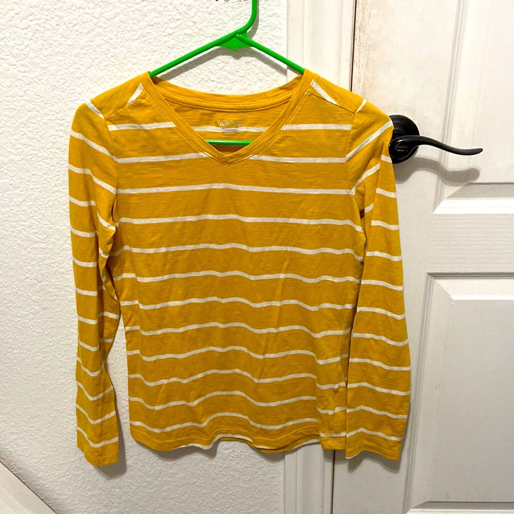 A yellow, striped long sleeve shirt